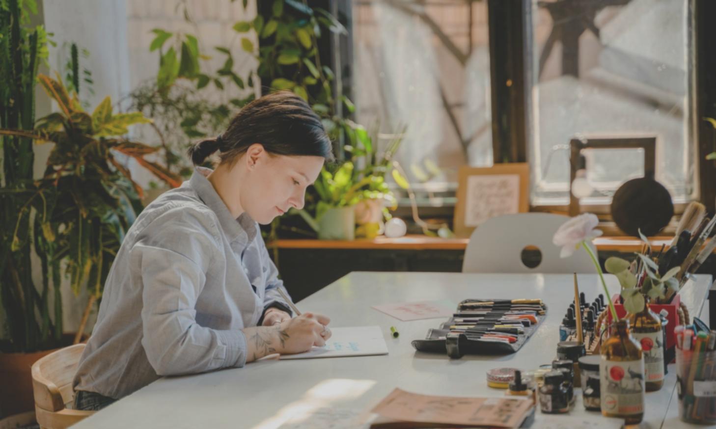 Students practicing color theory exercises with various art materials