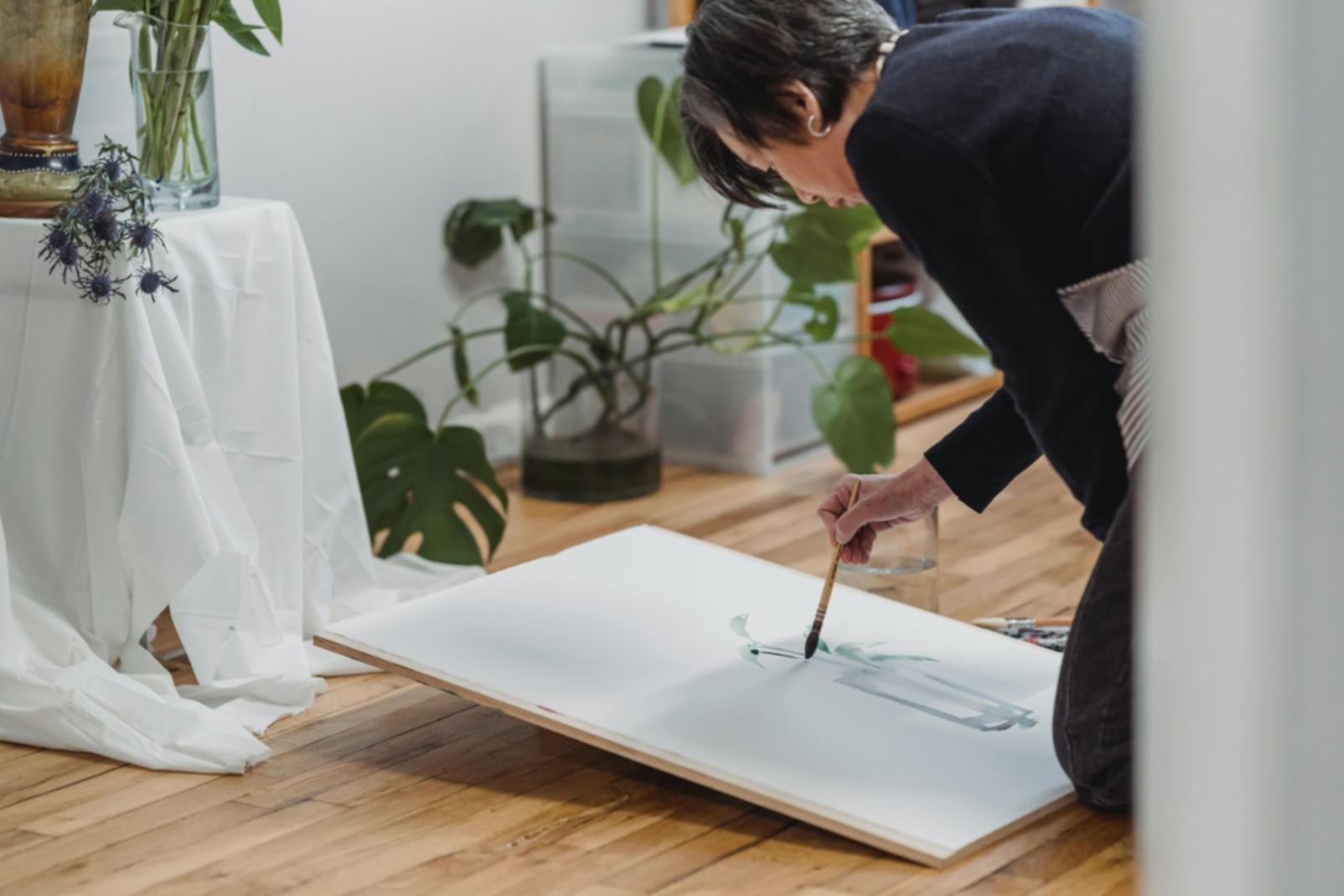 Student working on a colorful drawing demonstrating color theory principles